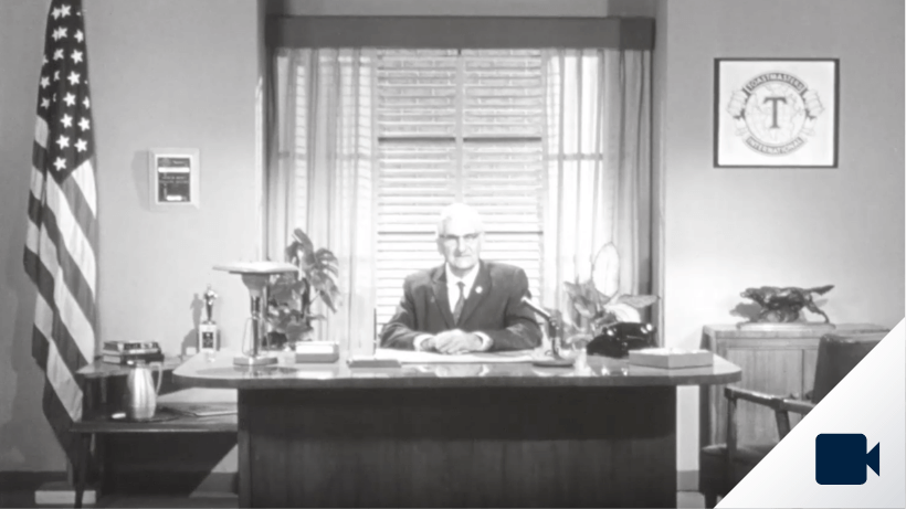 Ralph C. Smedley at his desk