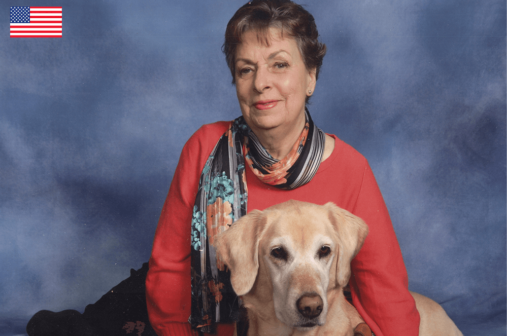 Woman posing with her seeing eye dog