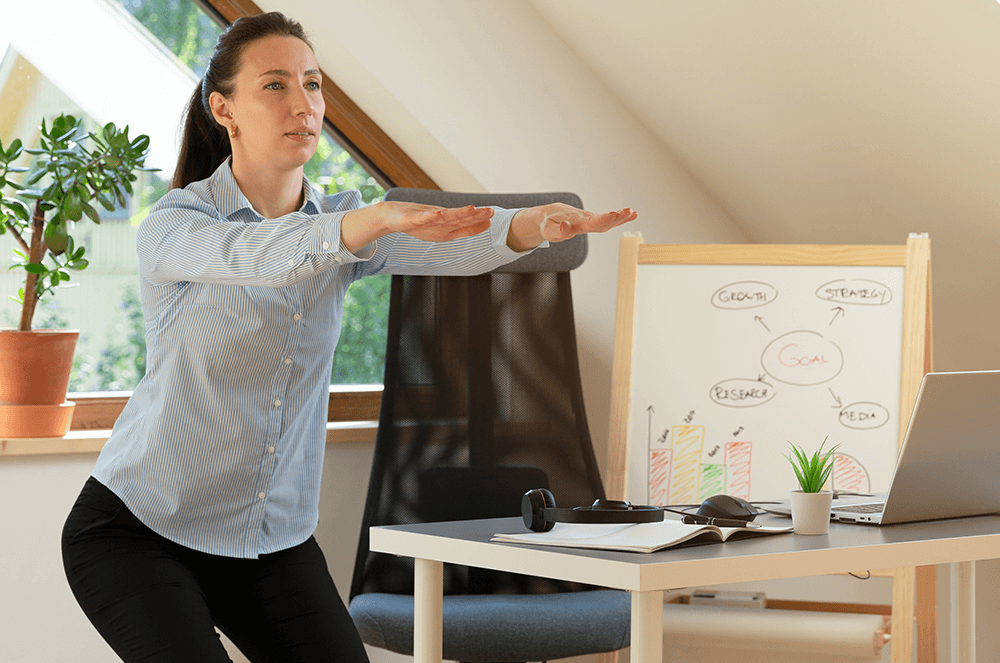 Woman doing a squat in her home office