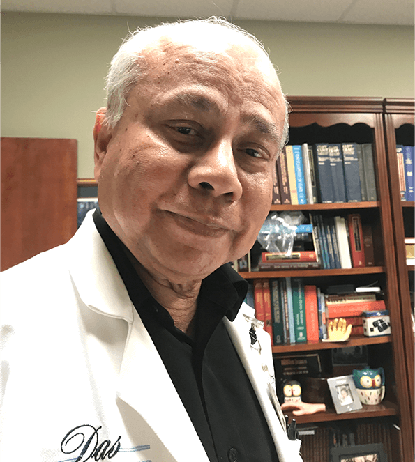 Doctor wearing white coat in office