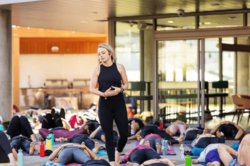 Woman teaching yoga class
