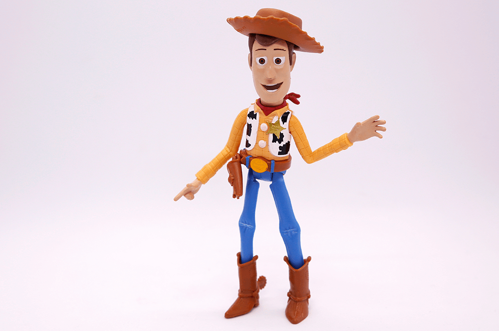 Cowboy toy Woody from Toy Story movie in boots, hat, and vest