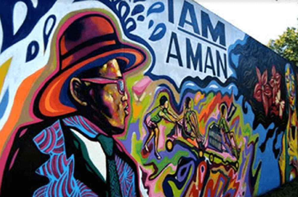 Colorful wall mural of jazz musician and slogan I Am A Man